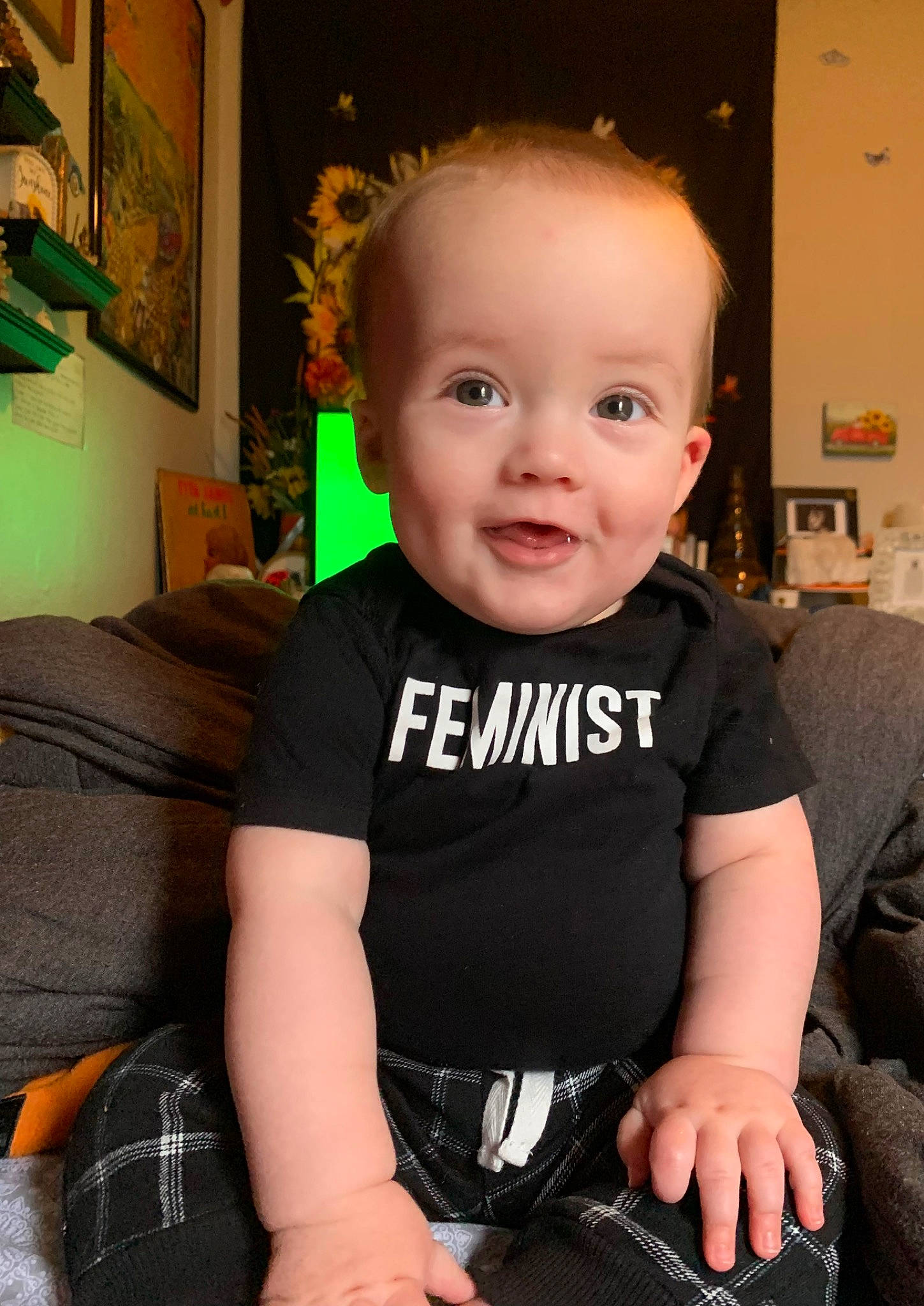 Genesis joined the competition — help win amazing prizes! baby, baby_toddler_clothing, cheek, child, chin, comfort, eye, fun, happy, houseplant, iris, pattern, person, picture_frame, plaid, sitting, skin, sleeve, smile, t_shirt