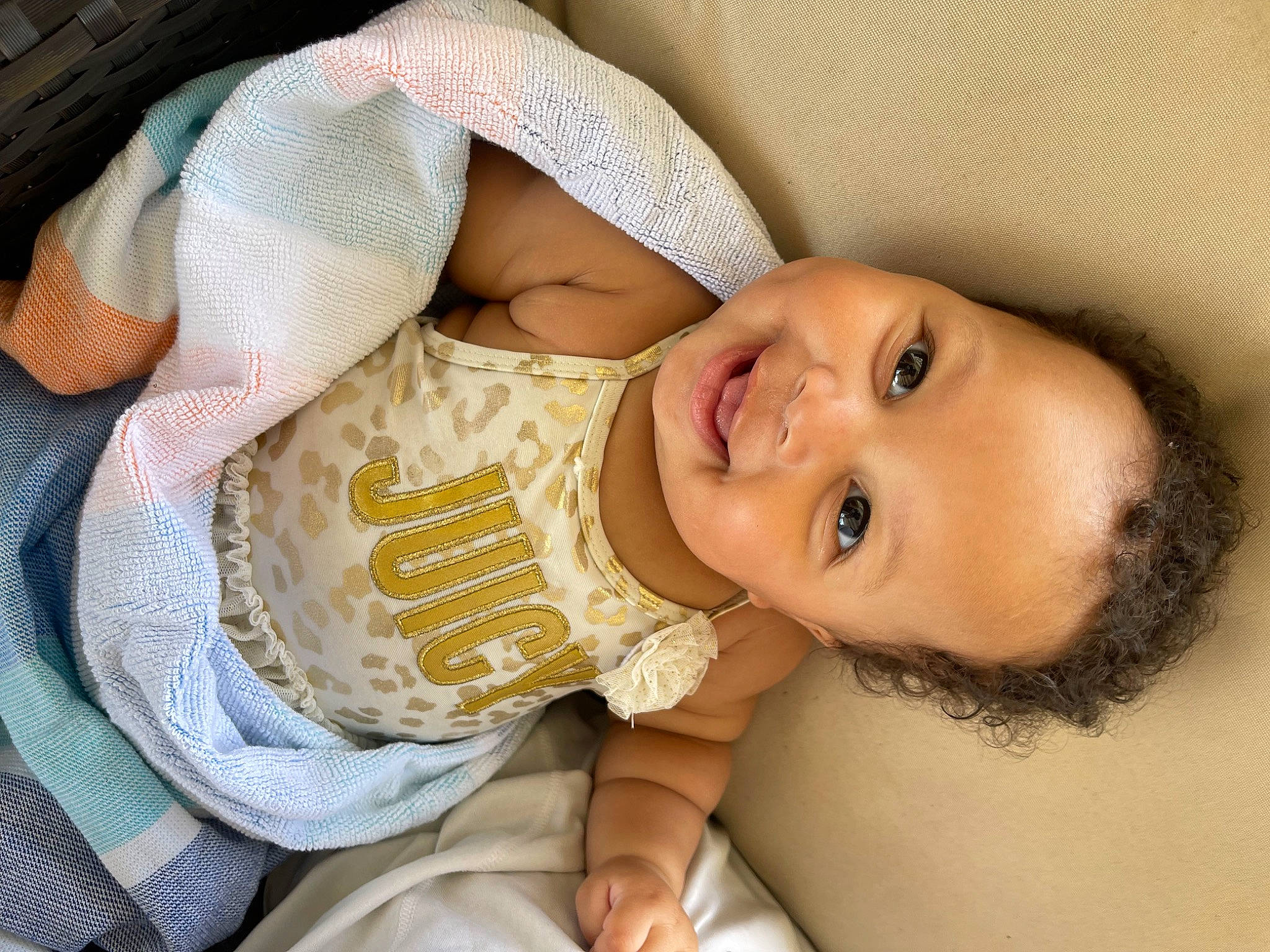 Mila is registered to the contest to win money with this photo: abdomen, baby, baby_toddler_clothing, cheek, comfort, dress, eyebrow, eyelash, gesture, happy, human_body, iris, joy, lip, mouth, nose, person, skin, sleeve, smile