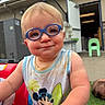 Jackson joined the competition — help win amazing prizes! toddler, child, glasses, blue_glasses, mickey_mouse, tank_top, dirty_clothes, red_toy_car, outdoor, smiling, face, short_hair, playful, grass, building, door, chair, person, cute, happy