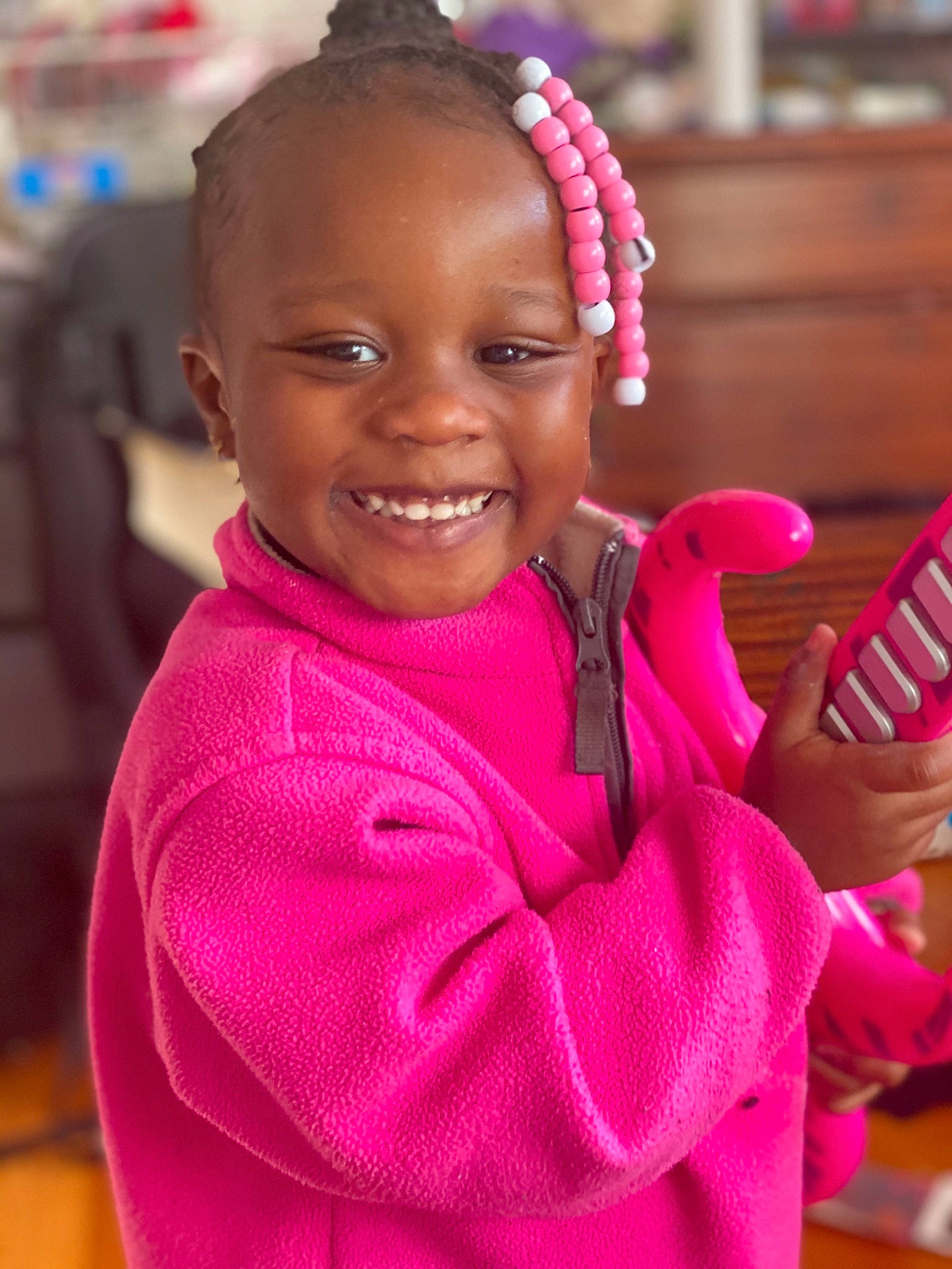 Honesty is registered to the contest to win money with this photo: braid, child, cornrows, finger, hair, hairstyle, happy, joy, lip, magenta, person, pink, smile