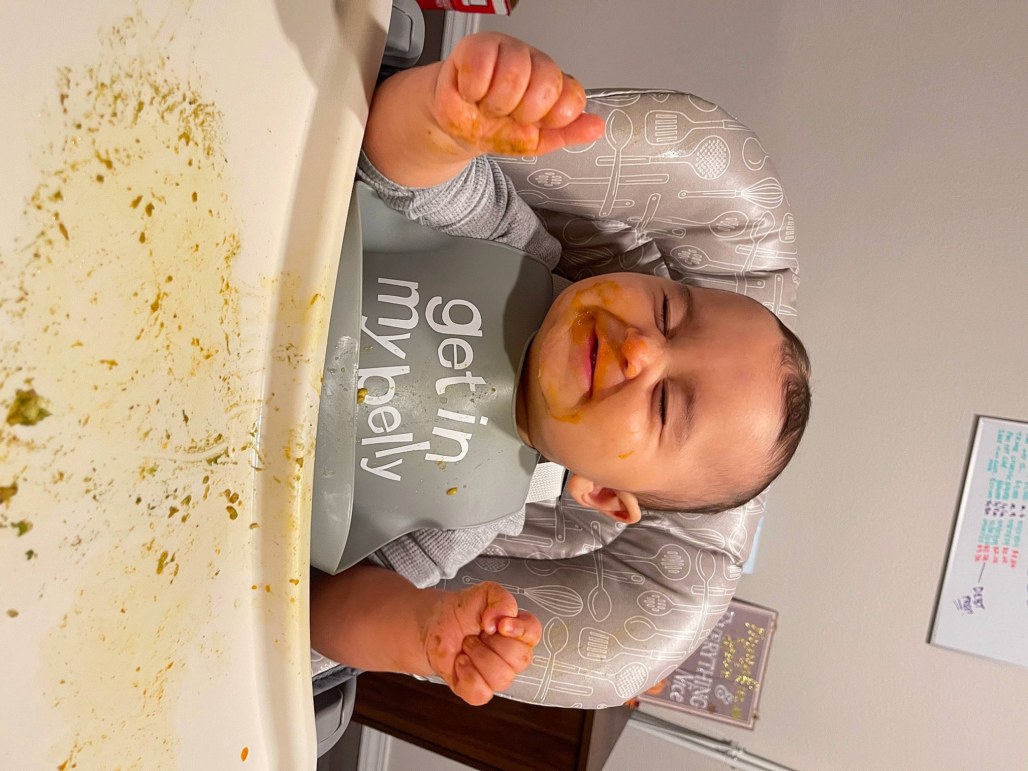 Kieran is registered to the contest to win money with this photo: baby, child, comfort_food, font, hand, handwriting, happy, joy, person, room, smile, tableware, tin_can, toddler, writing