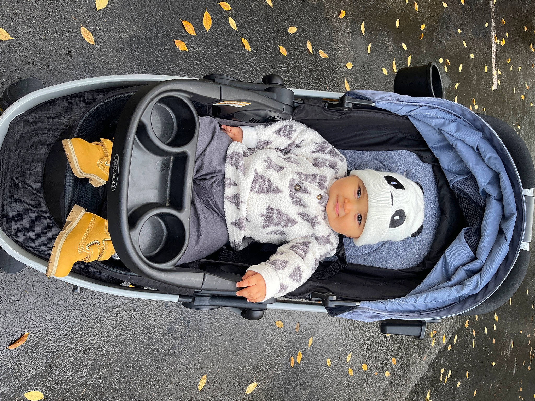 Kieran is registered to the contest to win money with this photo: asphalt, auto_part, automotive_design, automotive_exterior, automotive_lighting, automotive_tire, automotive_wheel_system, baby, baby_carriage, baby_products, bag, bumper, headwear, hood, luxury_vehicle, motor_vehicle, person, personal_luxury_car, space, toddler