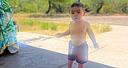 Gabriel is registered to the contest to win money with this photo: adult, boy, child, city, clothing, face, female, head, male, person, photography, portrait, road, shorts, sitting, street, summer, urban, walking, woman