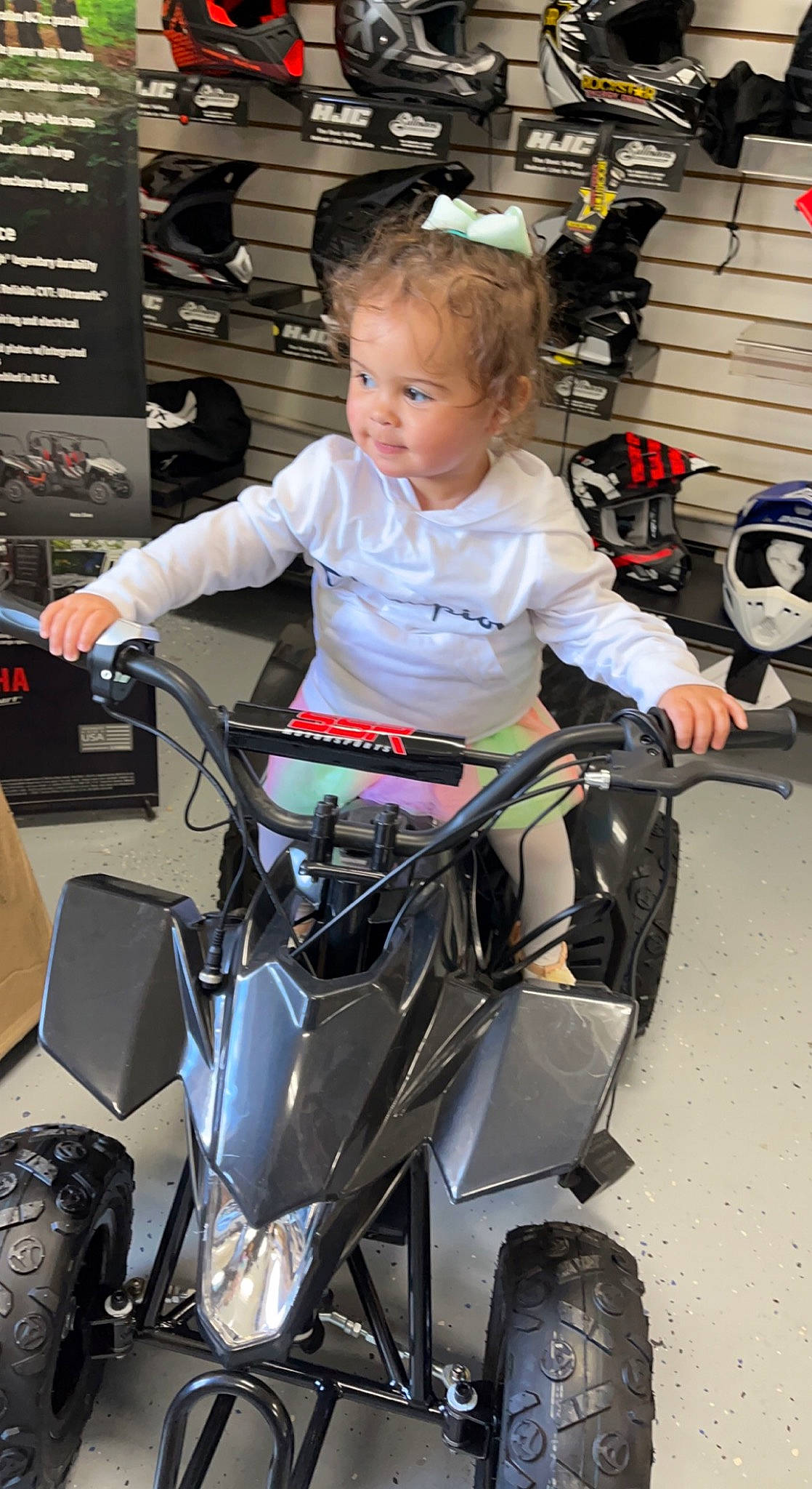 Mariana is registered to the contest to win money with this photo: auto_part, automotive_design, automotive_exterior, automotive_lighting, automotive_tire, automotive_wheel_system, baby, baby_carriage, baby_products, child, fender, motor_vehicle, person, recreation, rim, sitting, spoke, tire, toddler, vehicle