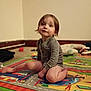 Otis is registered to the contest to win money with this photo: baby, candid, carpet, child, cute, diaper, expression, face, floor, hair, home, indoor, looking_up, onesie, play_mat, portrait, sitting, toddler, toys, wall