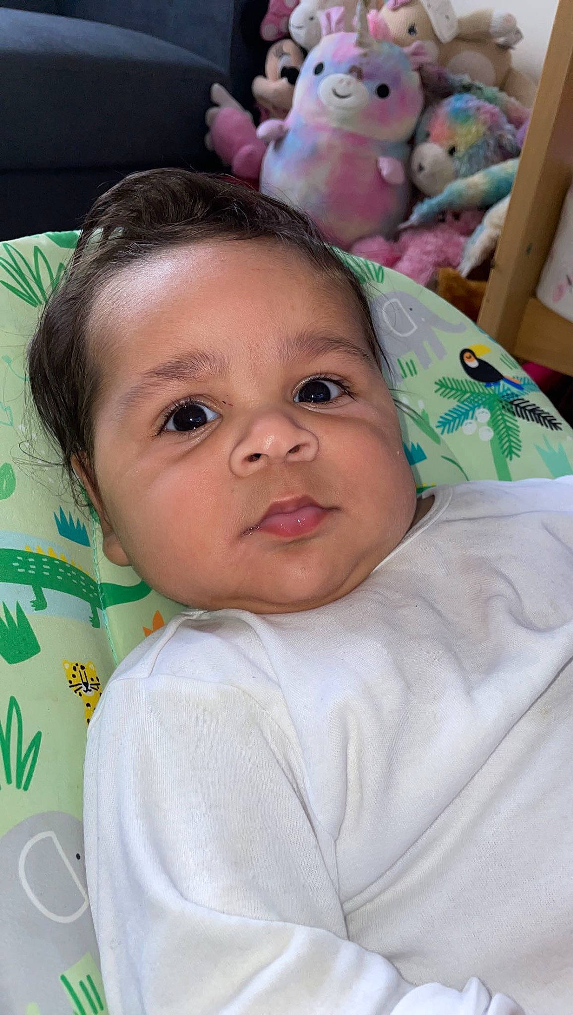 Ace is registered to the contest to win money with this photo: baby, cheek, child, ear, eyebrow, eyelash, forehead, happy, iris, linens, mouth, nose, organ, person, pink, skin, smile, textile, toddler, toy