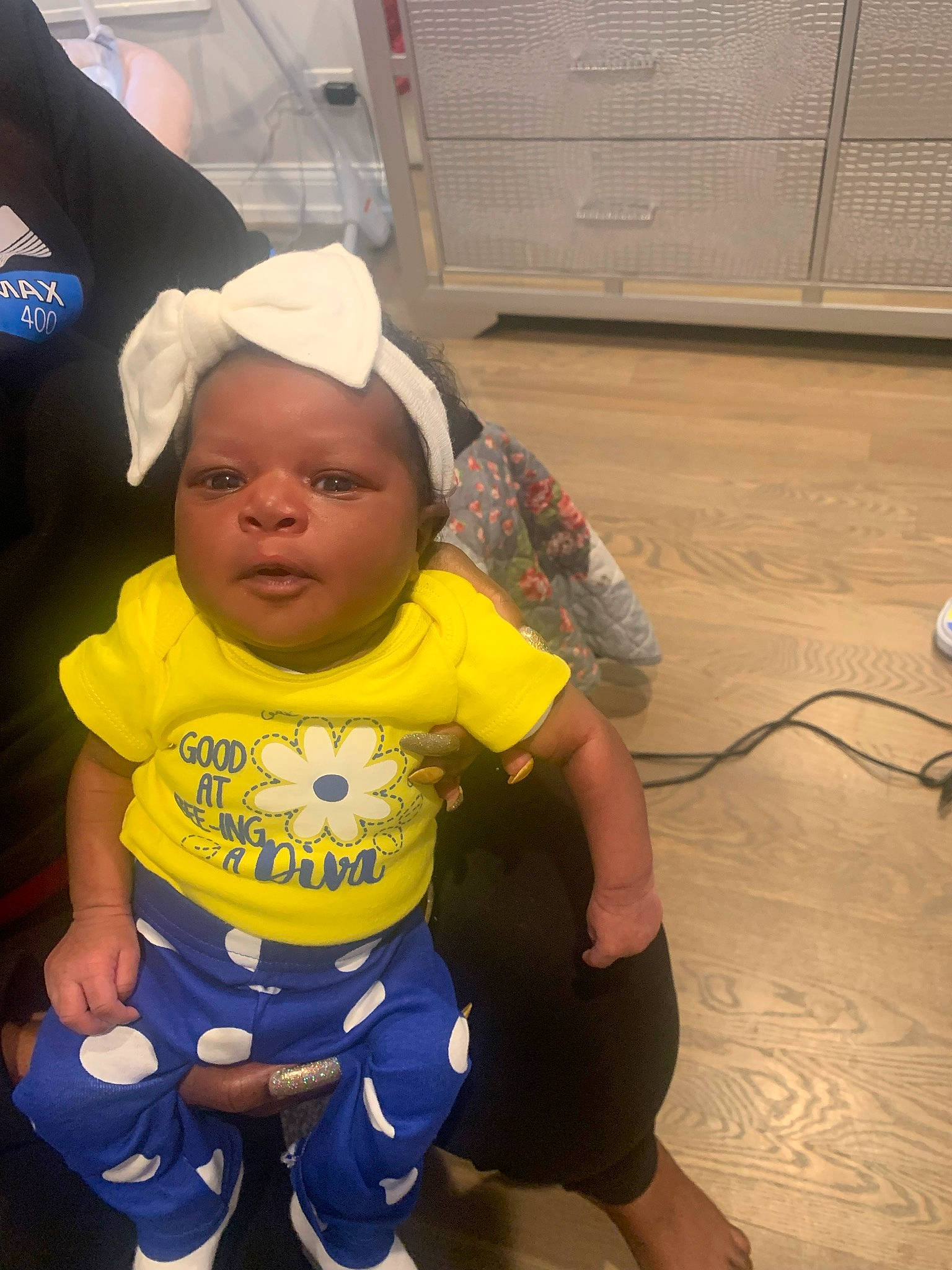 Lyana joined the competition — help win amazing prizes! baby, baby_toddler_clothing, baseball_cap, cabinetry, cap, child, flooring, fun, happy, person, personal_protective_equipment, sandal, shorts, sitting, skin, sleeve, t_shirt, thigh, thumb, toddler