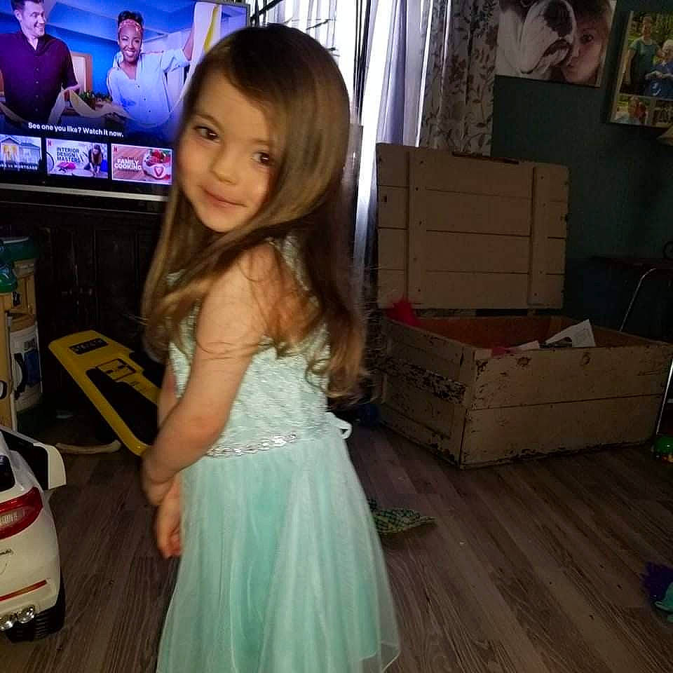 Olivia joined the competition — help win amazing prizes! brown_hair, car, child, event, floor, flooring, fun, happy, hardwood, human_leg, joy, long_hair, person, shipping_box, shoulder, skin, smile, snapshot, television, toddler