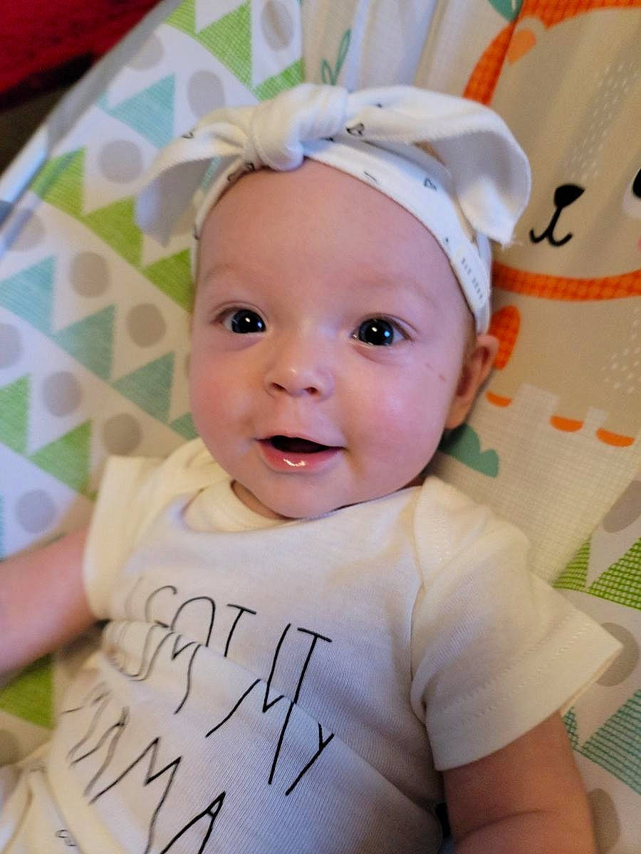 Madelyn joined the competition — help win amazing prizes! baby, baby_toddler_clothing, cheek, child, costume_hat, eyebrow, fashion_accessory, fun, hair_accessory, handwriting, happy, headband, pattern, person, pink, portrait_photography, sleeve, smile, t_shirt, textile