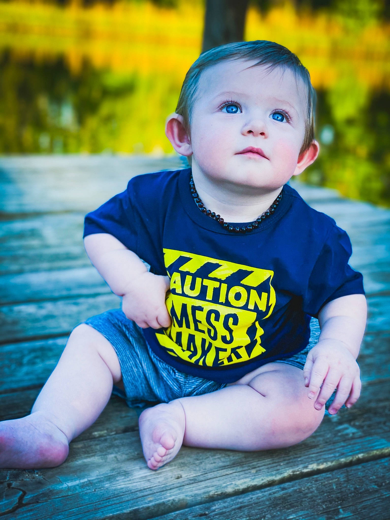 Leland is registered to the contest to win money with this photo: azure, baby, baby_toddler_clothing, electric_blue, eye, face, flash_photography, grass, happy, head, iris, leisure, people_in_nature, person, pink, plant, skin, sleeve, t_shirt, toddler