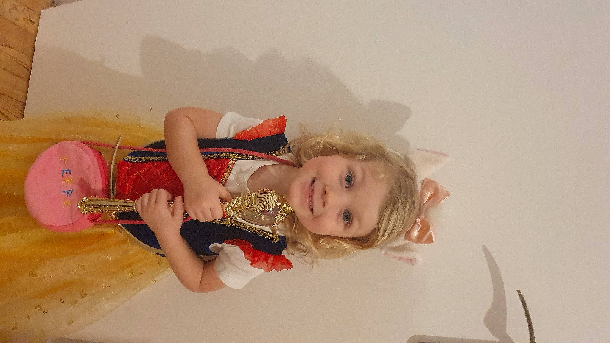 Margaux participe au concours pour gagner de l'argent avec cette photo : child, dress, eyelash, fashion_accessory, flash_photography, fun, happy, jewellery, joy, person, portrait_photography, room, sitting, smile, toddler