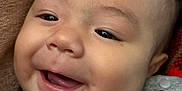 Mateo joined the competition — help win amazing prizes! baby, smiling, face, close_up, child, cheeks, eyes, clothing, grey_shirt, textile, happy, portrait, infant, cute, skin, head, young, expression, cozy, indoor