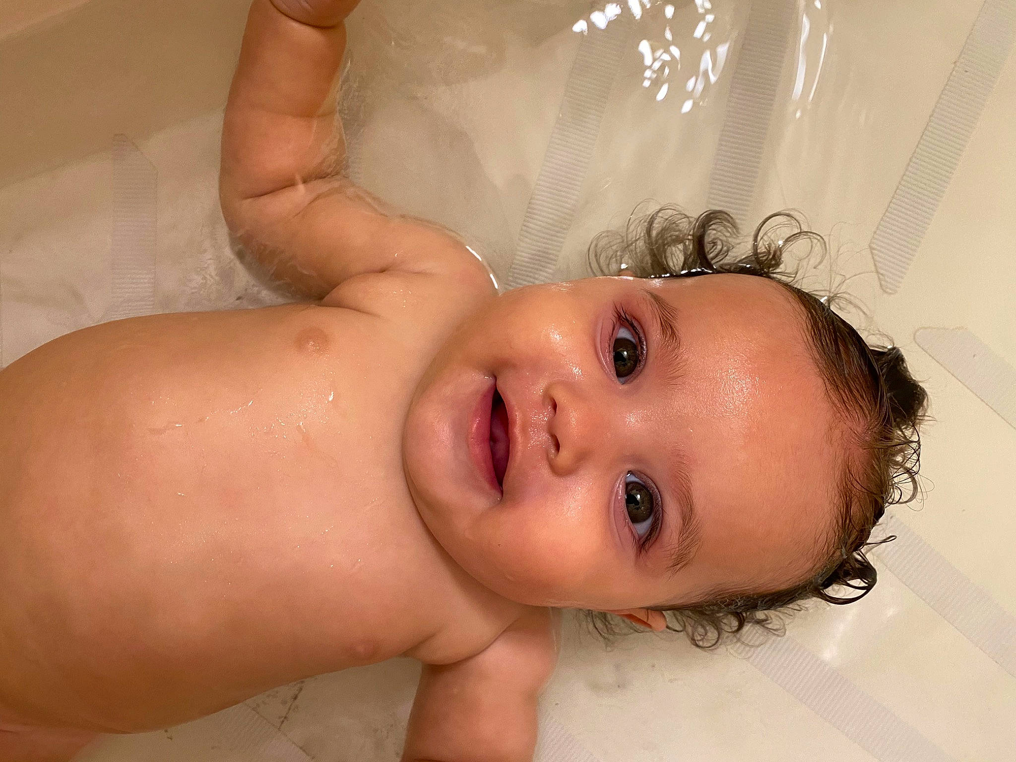 Jezebel is registered to the contest to win money with this photo: arm, baby, bathing, cheek, chest, eye, eyebrow, eyelash, hair, human_body, iris, jaw, lip, mouth, neck, nose, person, skin, smile, stomach