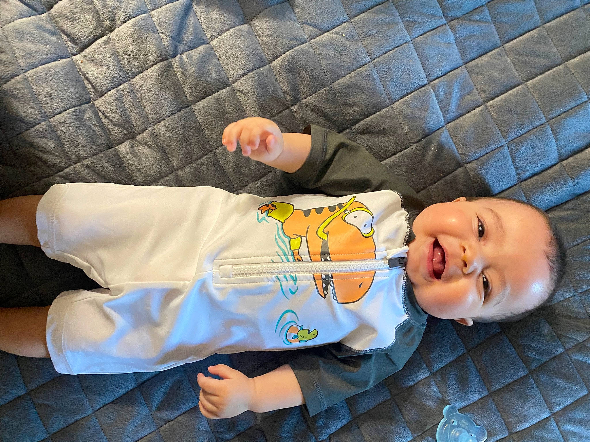 Ace joined the competition — help win amazing prizes! baby, baby_toddler_clothing, child, comfort, elbow, face, finger, gesture, hand, hat, head, human_body, mammal, orange, person, sitting, skin, sleeve, smile, textile