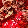 Jaina Willow is registered to the contest to win money with this photo: baby, christmas_hat, smile, holiday_decorations, red_clothing, gift_wrap, festive, lights, face, infant, celebration, plush_toy, christmas_theme, red_ribbon, patterned_wrapping_paper, indoors, cute, joyful, seasonal, portrait