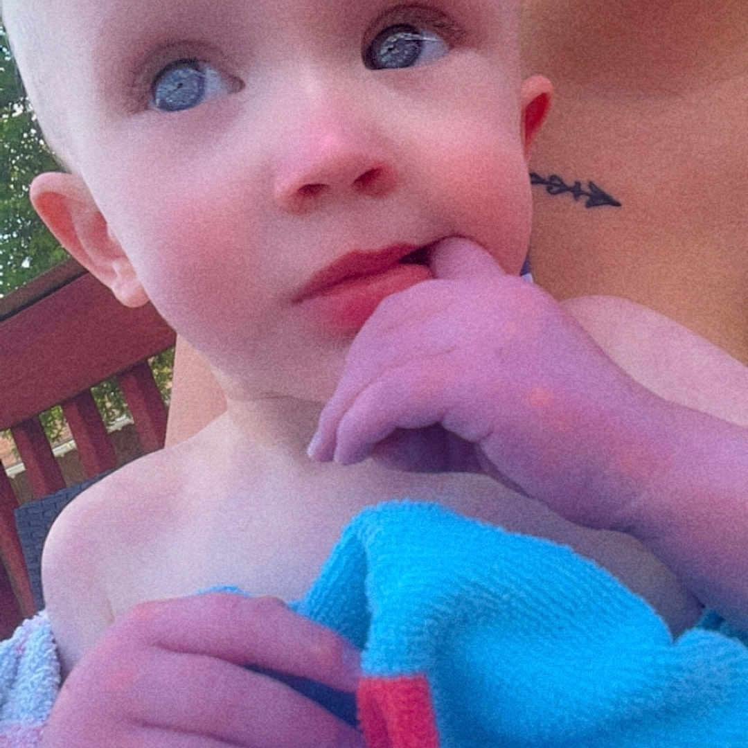 Sophie is registered to the contest to win money with this photo: baby, blanket, bodypart, chair, face, finger, furniture, grass, hand, head, newborn, person, photography, plant, portrait, quilt, skin, tattoo, towel, toy