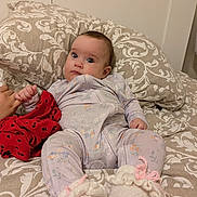 Tomris Aden joined the competition — help win amazing prizes! baby, infant, bed, pillow, blanket, onesie, booties, hand, pattern, floral, clothing, fabric, cute, child, indoor, person, portrait, sleepwear, resting, soft