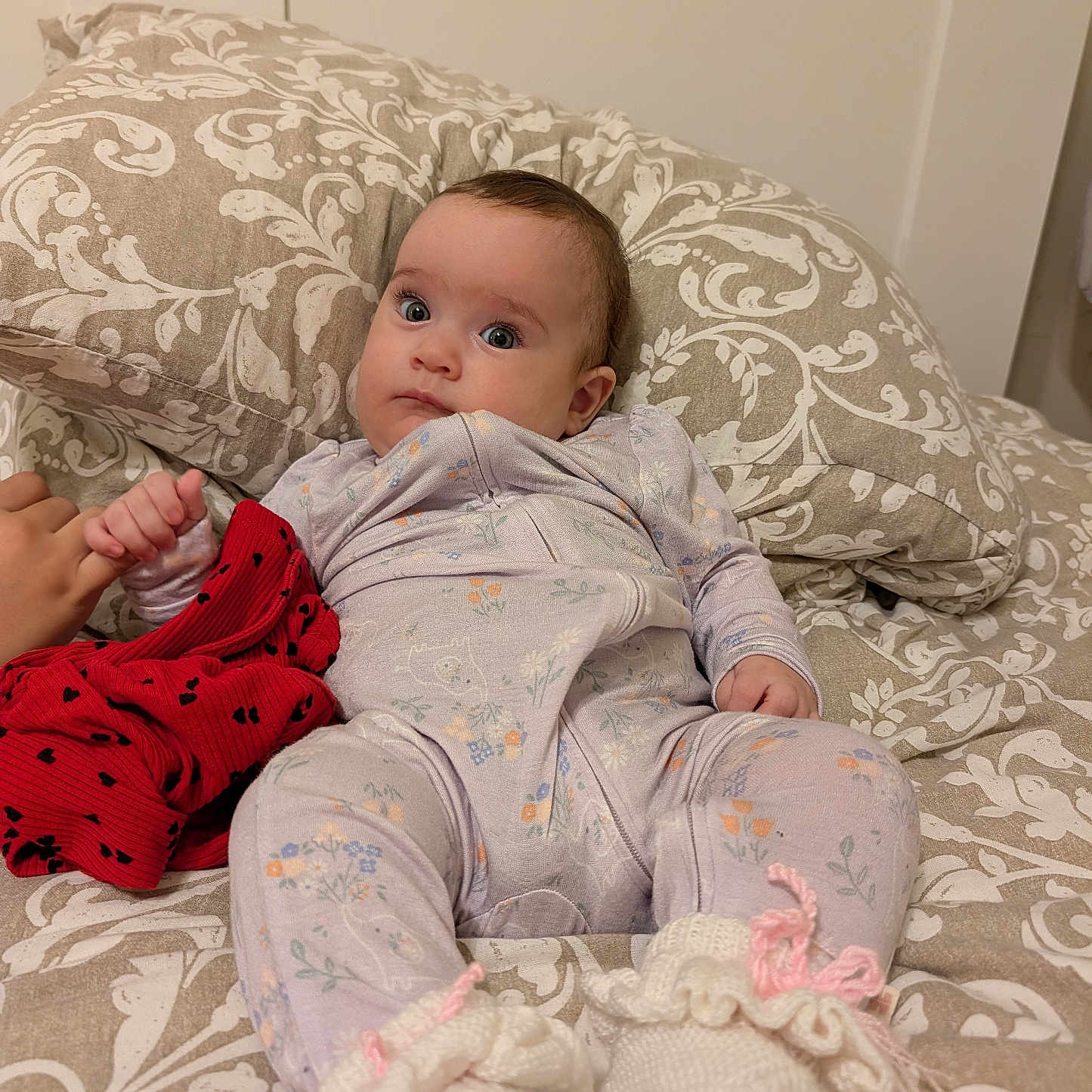 Tomris Aden joined the competition — help win amazing prizes! baby, bed, blanket, booties, child, clothing, cute, fabric, floral, hand, indoor, infant, onesie, pattern, person, pillow, portrait, resting, sleepwear, soft