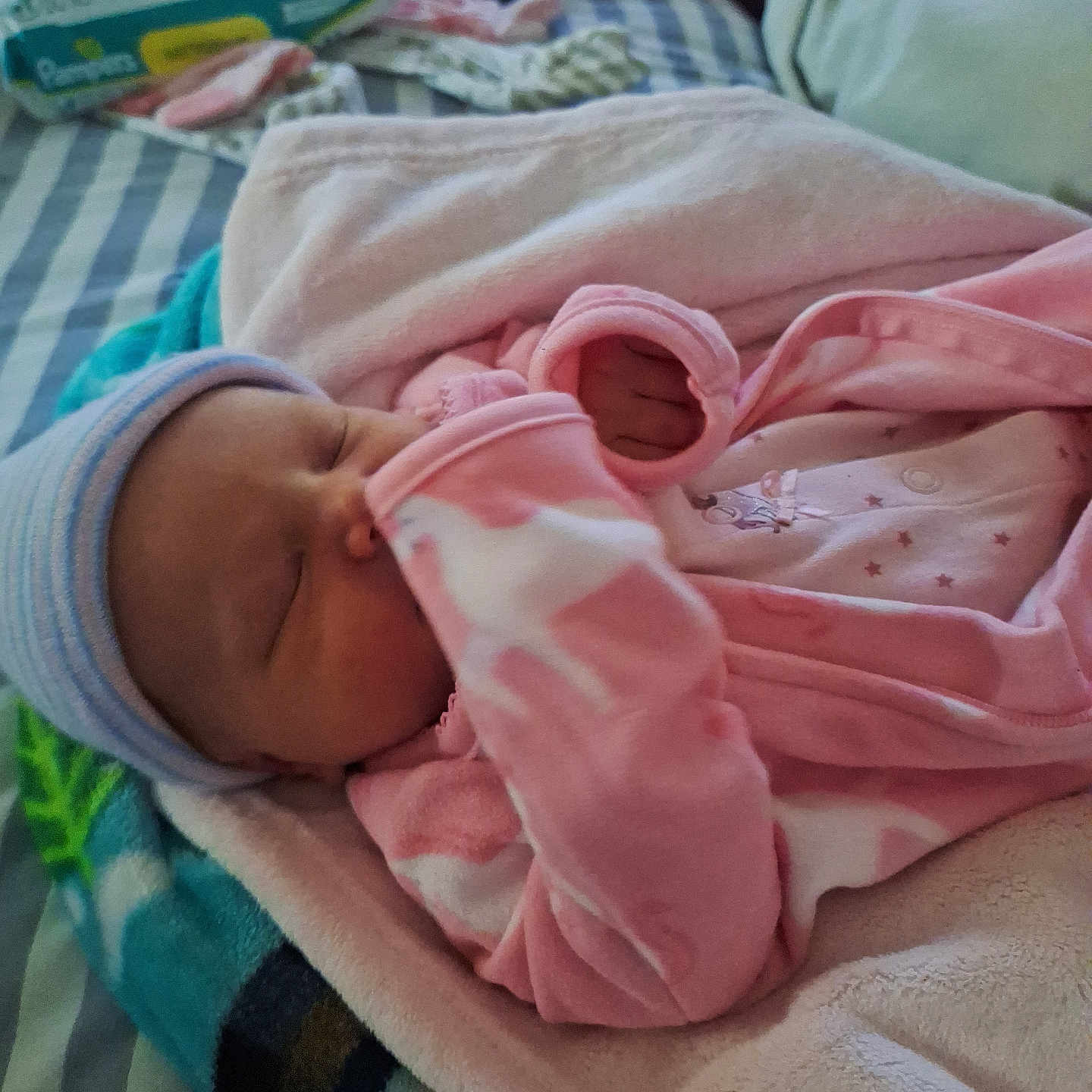 Riely is registered to the contest to win money with this photo: baby, bed, blanket, bonnet, clothing, couch, electronics, face, furniture, hat, head, mobilephone, newborn, person, phone, photography, portrait, quilt, sleeping, towel