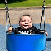 Walker joined the competition — help win amazing prizes! baby, swing, playground, child, smiling, happy, outdoor, sunlight, blue, clothing, grass, seat, metal, chain, fun, person, cute, joy, park, toddler