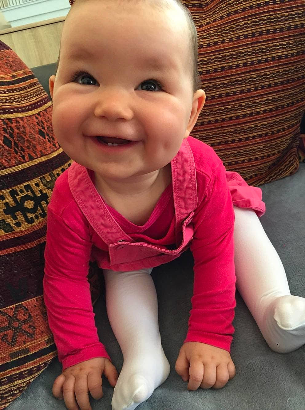 Maëlyce a rejoint le concours — aidez-le/la à gagner de superbes lots ! cheek, child, day, eye, facial_expression, fun, girl, happiness, infant, iris, joy, laughter, leg, person, pink, product, sitting, skin, smile, standing