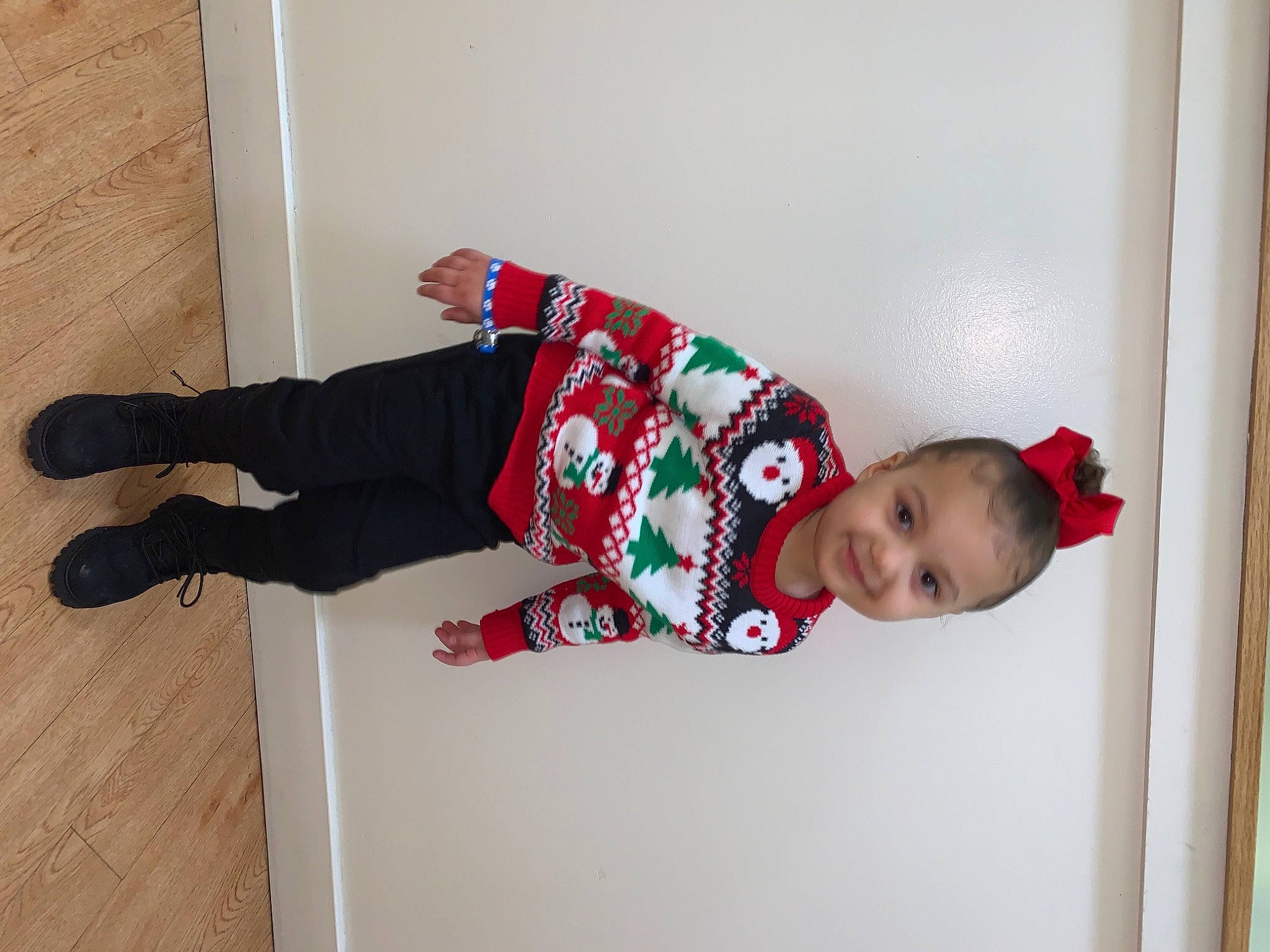 Melani is registered to the contest to win money with this photo: baby_safety, baby_toddler_clothing, carmine, child, collar, comfort, costume, flooring, happy, hardwood, joy, magenta, pattern, person, room, sleeve, smile, sock, toddler, wood