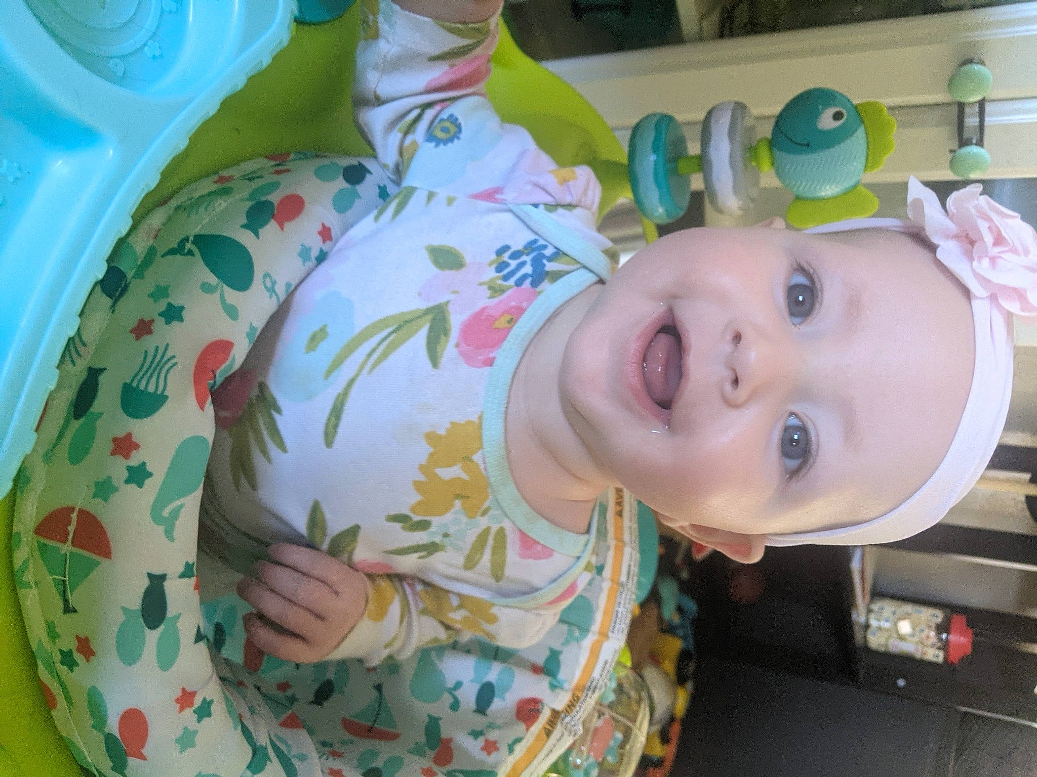 Kya is registered to the contest to win money with this photo: baby, baby_products, baby_toddler_clothing, chair, cheek, child, eye, eyelash, fun, happy, human_body, mouth, nose, person, product, room, skin, smile, toddler, toy