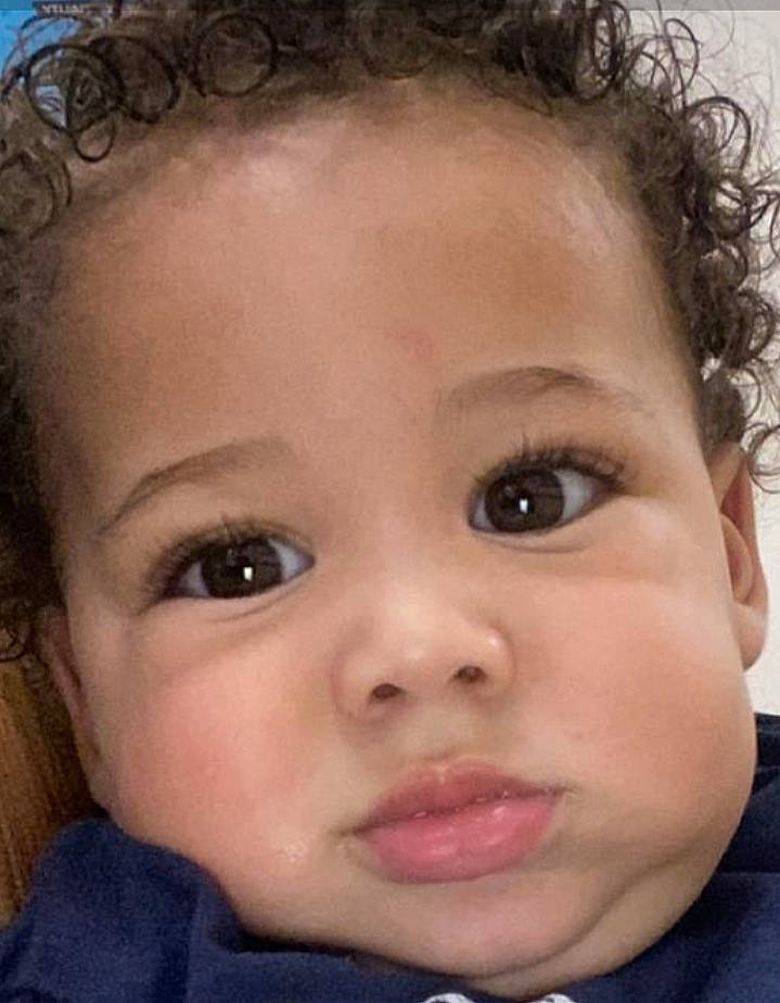 Malakai is registered to the contest to win money with this photo: cheek, chin, ear, eyebrow, eyelash, forehead, hair, hairstyle, happy, iris, jaw, lip, mouth, neck, nose, organ, person, photograph, skin, toddler