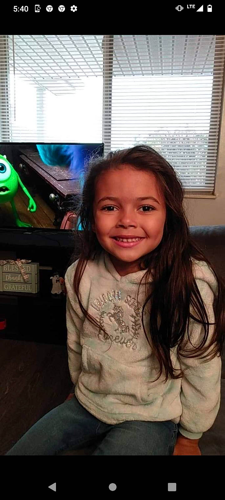 Ariana joined the competition — help win amazing prizes! audio_equipment, brown_hair, child, display_device, flash_photography, fun, happy, iris, joy, long_hair, machine, person, room, sitting, smile, standing, t_shirt, television_set, toddler, vehicle_door