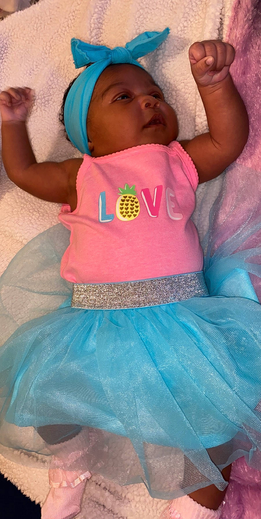 Aryn is registered to the contest to win money with this photo: aqua, baby, baby_toddler_clothing, blue, child, clothing, costume, headwear, person, pink, teal, toddler, turquoise