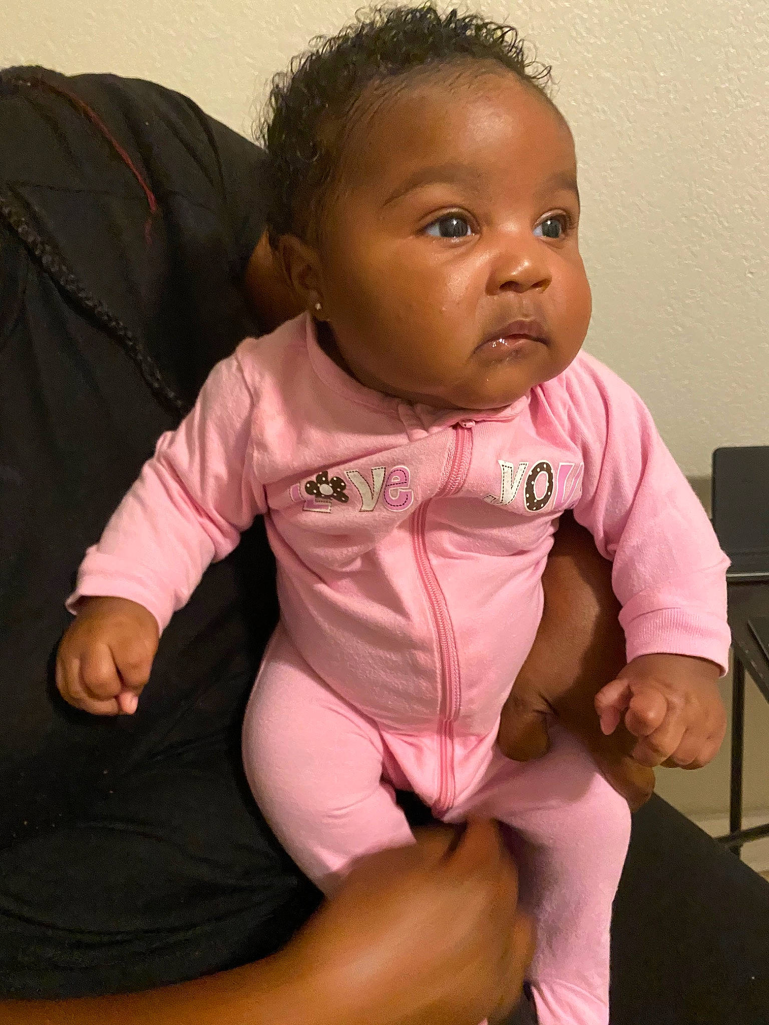 Aryn is registered to the contest to win money with this photo: arm, baby, baby_toddler_clothing, cheek, child, head, joint, neck, person, pink, sitting, skin, toddler