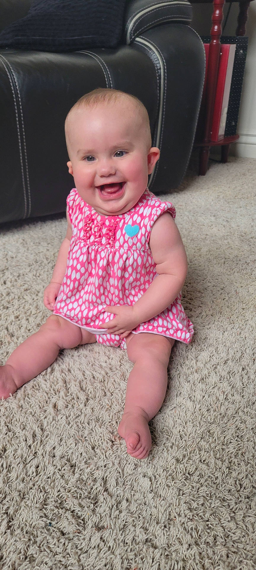 Ila is registered to the contest to win money with this photo: architecture, baby, building, clothing, couch, cushion, dress, face, furniture, happy, head, homedecor, indoors, laughing, livingroom, person, photography, portrait, room, sitting