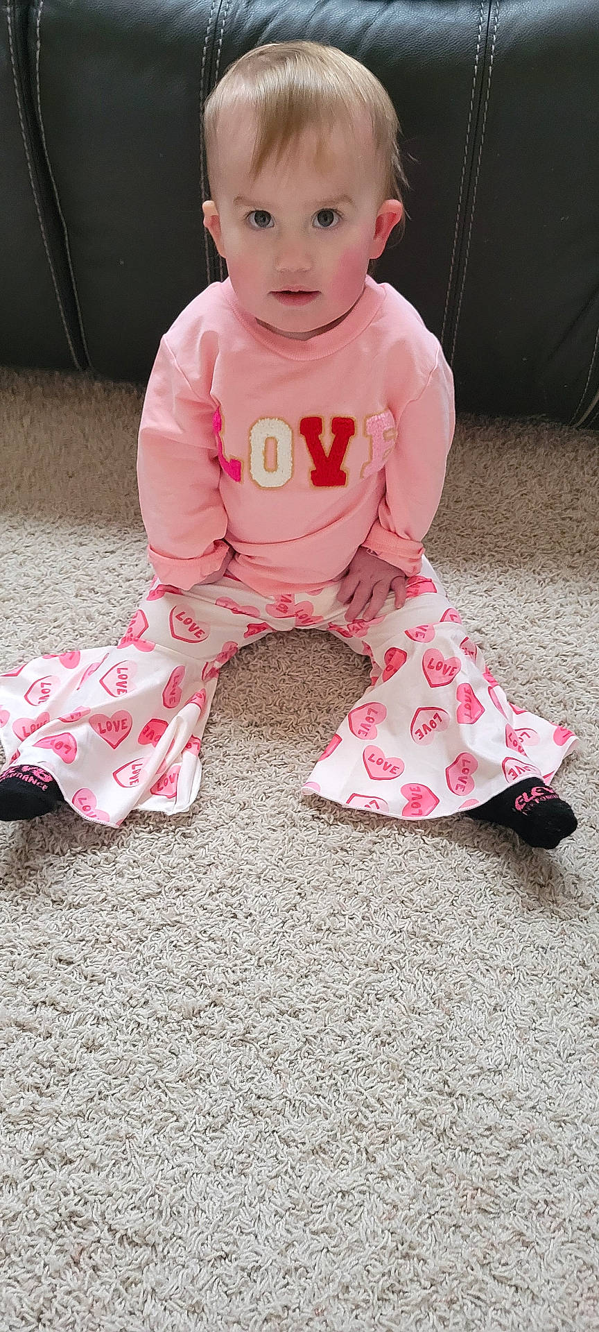 Ila joined the competition — help win amazing prizes! architecture, baby, building, clothing, couch, face, furniture, head, homedecor, hosiery, indoors, livingroom, pajamas, pants, person, photography, portrait, room, sitting, sock