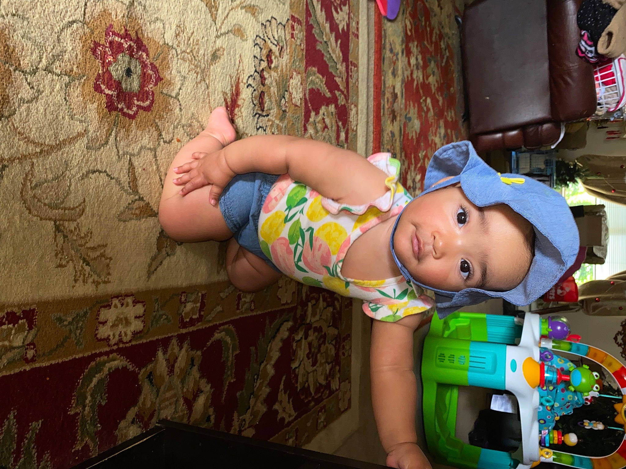 Avayah is registered to the contest to win money with this photo: abdomen, baby, baseball_cap, chest, child, flesh, fun, happy, hat, human_leg, leisure, pattern, person, pink, play, room, sandal, thigh, toddler, toy