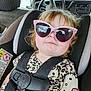 car_interior, car_seat, child, cracked_windshield, cute, expression, face, fashion, hair, hello_kitty, indoors, leopard_print, pink, portrait, safety_harness, seat, seatbelt, sunglasses, toddler, young_child