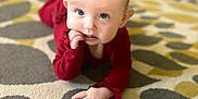 Brynnleigh joined the competition — help win amazing prizes! baby, blond_hair, carpet, chewing_finger, child, crawling, curious, cute, eyes, face, floor, hand, home, indoor, infant, patterned_rug, portrait, red_clothing, soft_lighting, young_child