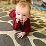 baby, blond_hair, carpet, chewing_finger, child, crawling, curious, cute, eyes, face, floor, hand, home, indoor, infant, patterned_rug, portrait, red_clothing, soft_lighting, young_child