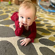 Brynnleigh is registered to the contest to win money with this photo: baby, blond_hair, carpet, chewing_finger, child, crawling, curious, cute, eyes, face, floor, hand, home, indoor, infant, patterned_rug, portrait, red_clothing, soft_lighting, young_child