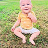 baby, child, grass, outdoor, smile, yellow_shirt, shorts, barefoot, greenery, field, nature, happy, portrait, sitting, summer, sun_pattern, cute, one_person, daylight, sky