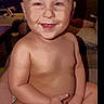 Bjorn joined the competition — help win amazing prizes! baby, smiling, indoor, child, happy, sitting, diaper, skin, face, person, adult, television, furniture, couch, hand, head, room, people, background, portrait