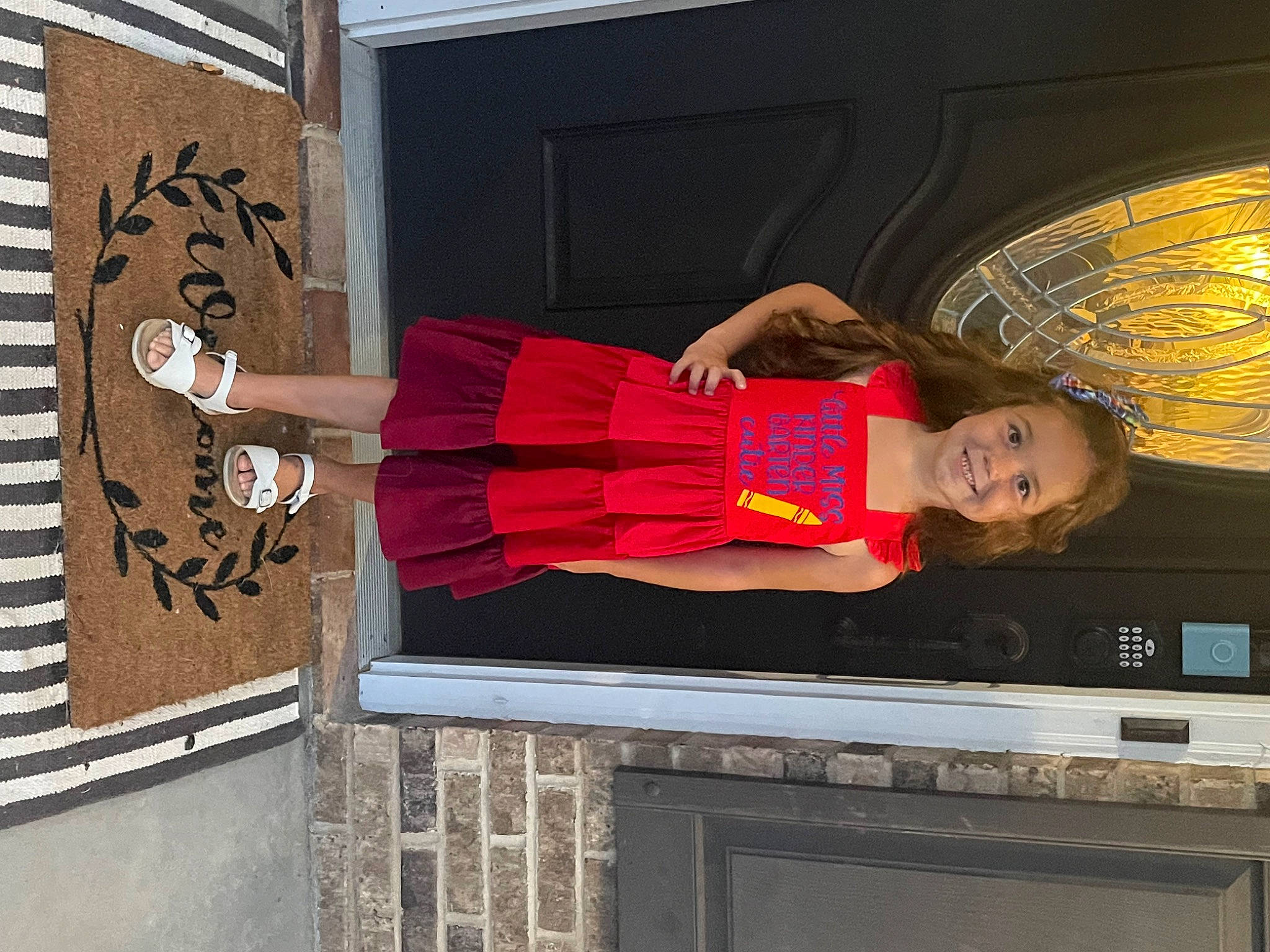 Brooklyn is registered to the contest to win money with this photo: advertising, building, display_device, dress, eyewear, facade, home_appliance, house, human_leg, joy, magenta, orange, person, room, sportswear, t_shirt, television, television_set, tire, vacation