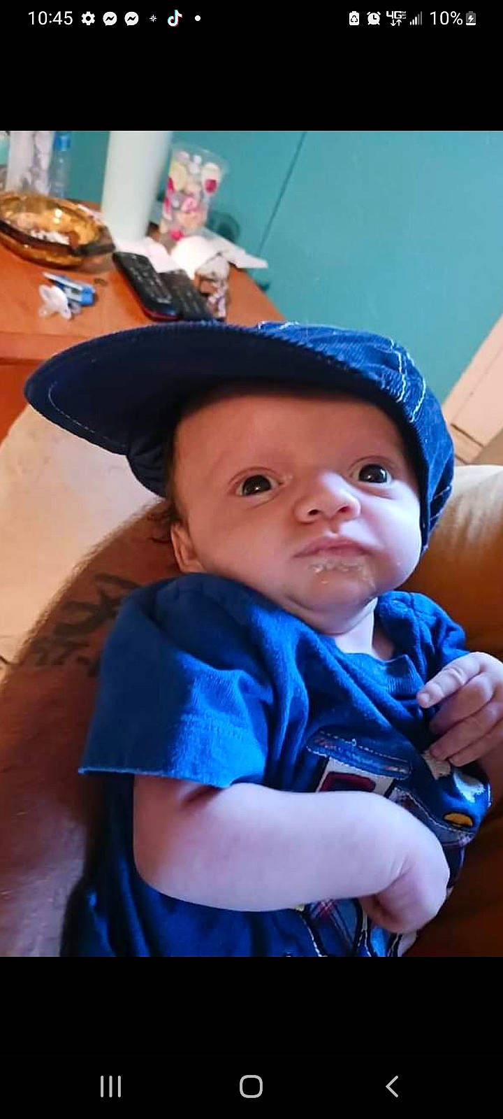 Logan joined the competition — help win amazing prizes! baby, blue, cap, cheek, child, chin, cool, electric_blue, fashion_accessory, fun, happy, hat, headgear, headwear, mouth, person, personal_protective_equipment, purple, sitting, smile