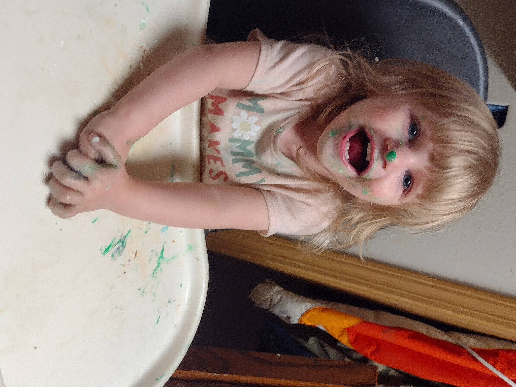 Mckinley joined the competition — help win amazing prizes! baby, baby_toddler_clothing, brown_hair, child, dress, elbow, eyelash, fun, gesture, happy, human_body, long_hair, neck, person, shoulder, sleeve, sunglasses, tableware, toddler, wood