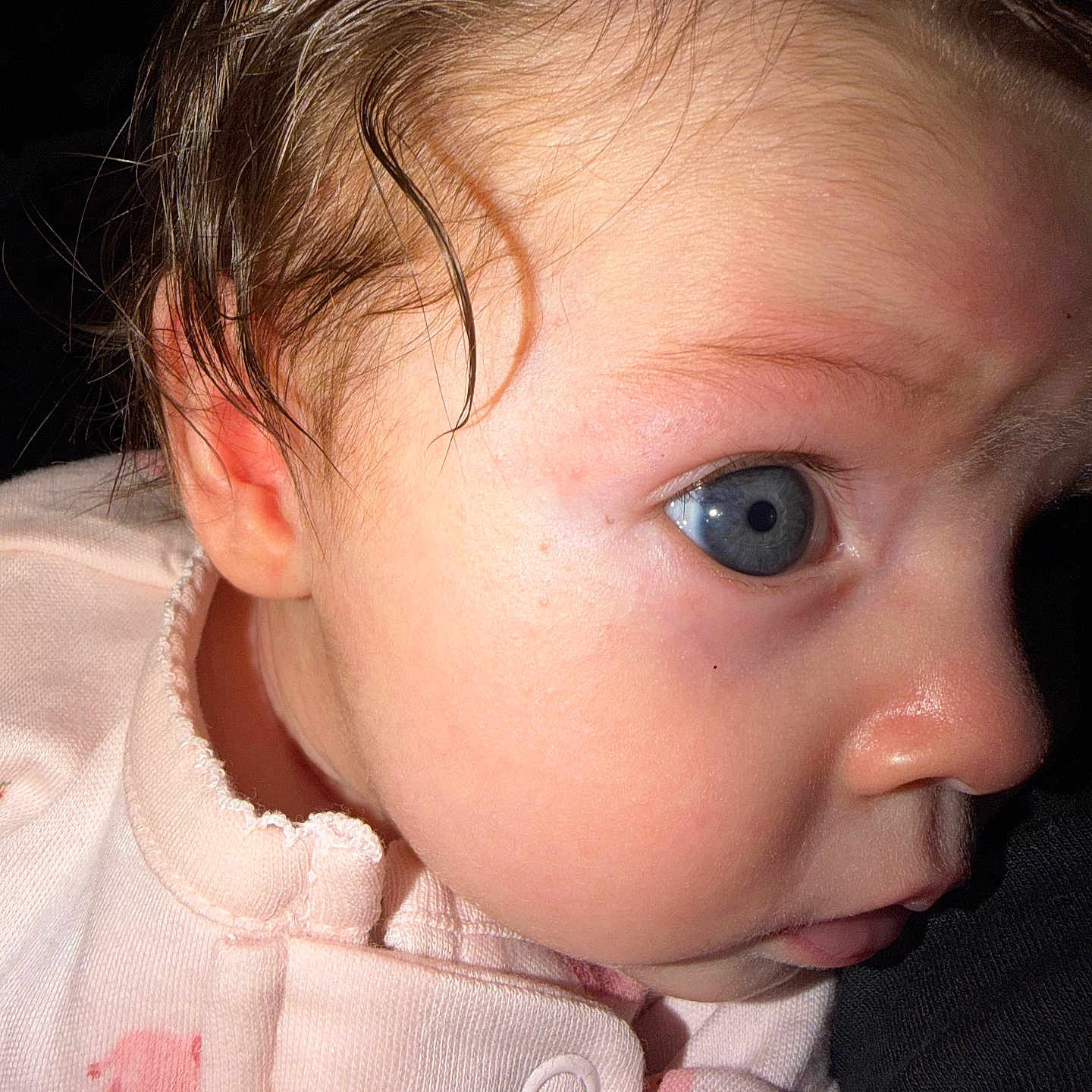 Xenaida is registered to the contest to win money with this photo: baby, blue_eyes, child, closeup, clothing, cute, expression, face, human, indoors, infant, looking, newborn, person, pink_outfit, portrait, skin, soft_light, wet_hair, young