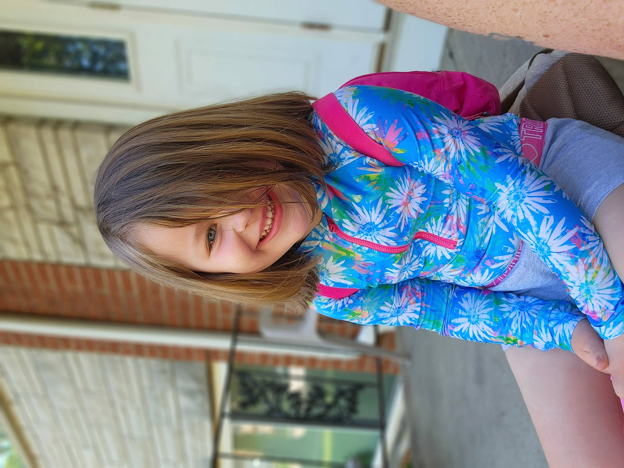 Aspen is registered to the contest to win money with this photo: bangs, child, comfort, denim, elbow, electric_blue, fashion_accessory, fun, hairstyle, happy, human_leg, joint, joy, leisure, magenta, pattern, person, shoulder, smile, textile