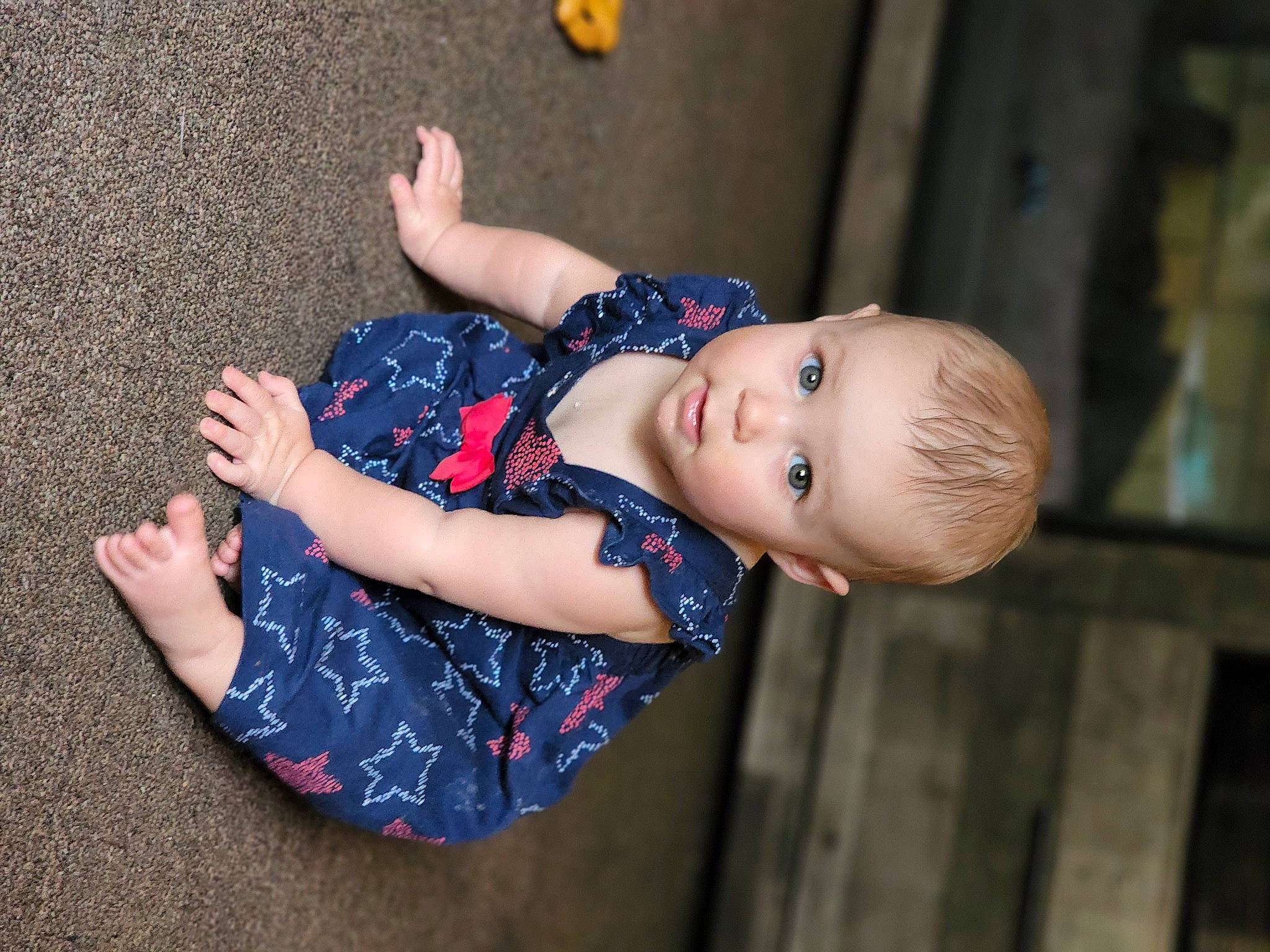 Mykenzeigh is registered to the contest to win money with this photo: arm, child, elbow, electric_blue, finger, flash_photography, fun, gesture, happy, human_body, human_leg, joint, pattern, person, skin, sleeve, thigh, toddler, tree, wood