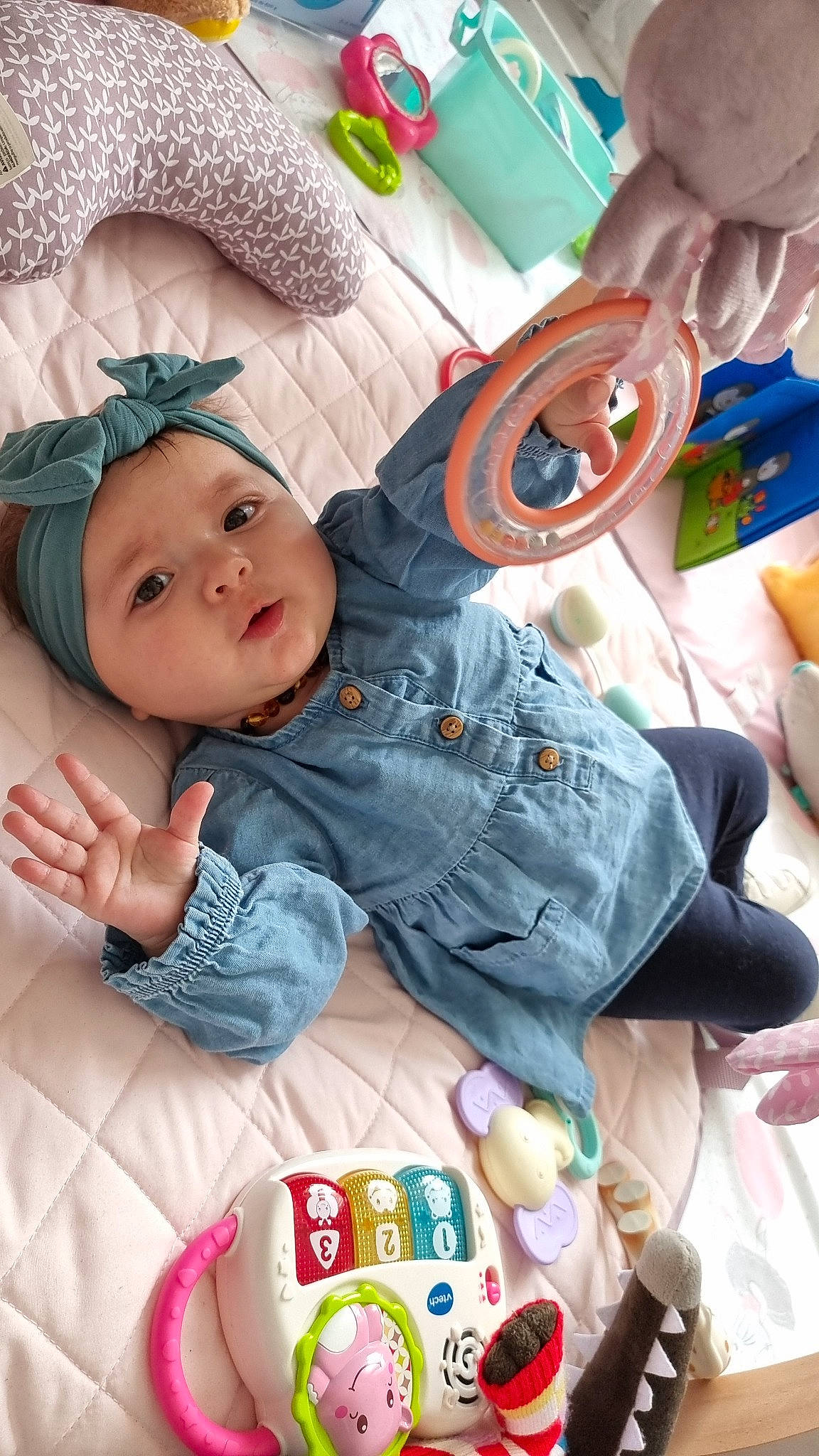 Julianna participe au concours pour gagner de l'argent avec cette photo : baby, baby_products, baby_toddler_clothing, beanie, cheek, child, comfort, grass, happy, hat, headwear, linens, pattern, person, play, portrait_photography, room, sitting, skin, sleeve
