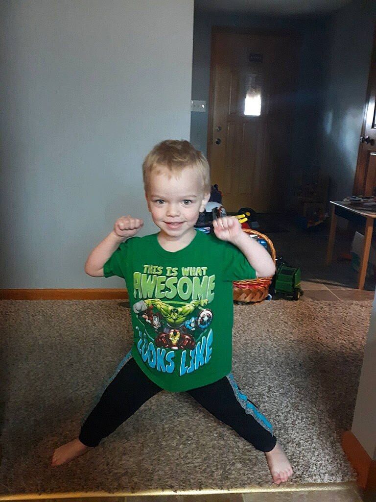 Karsyn joined the competition — help win amazing prizes! arm, child, fictional_character, floor, fun, green, joy, person, play, sitting, sleeve, smile, standing, t_shirt, toddler