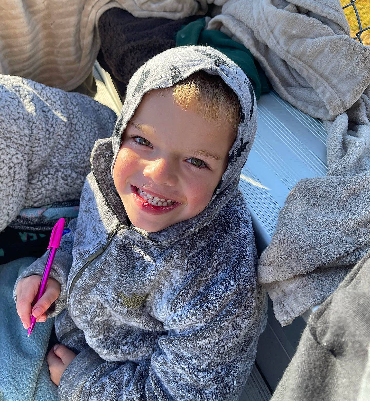 Karsyn is registered to the contest to win money with this photo: cap, child, comfort, cool, denim, electric_blue, facial_expression, fashion_accessory, freezing, fur, happy, headgear, headwear, hoodie, joy, mouth, outerwear, person, sitting, smile