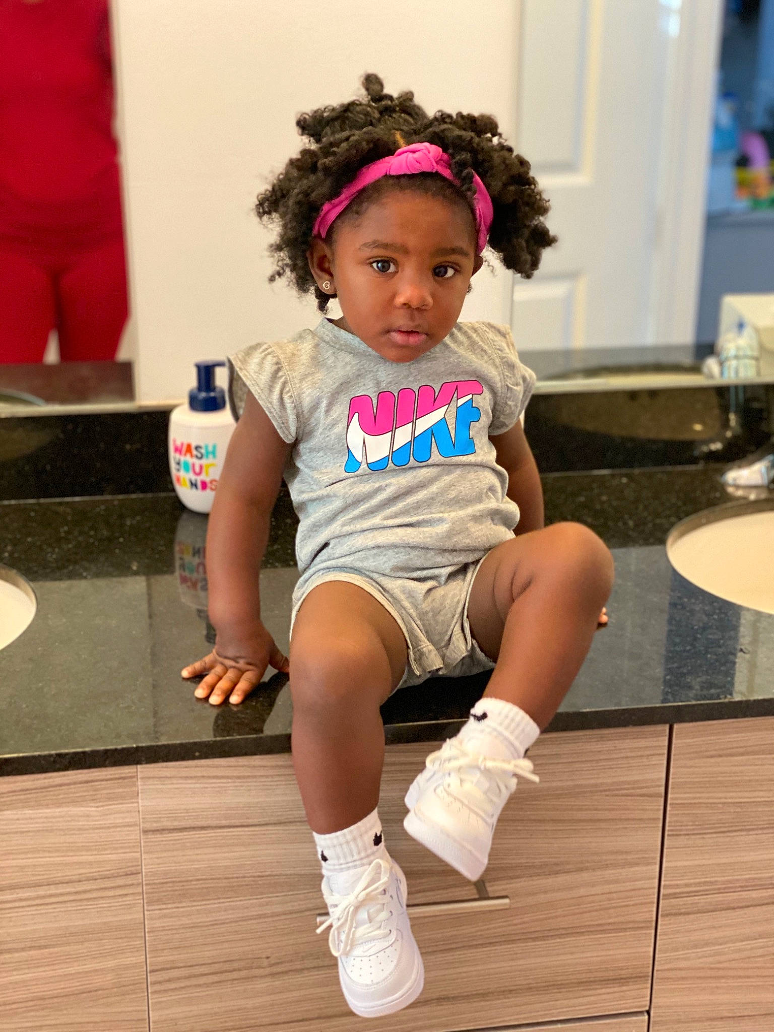 Talia is registered to the contest to win money with this photo: baby, child, child_model, costume, footwear, fun, hair_accessory, hairstyle, headband, knee, leg, person, pink, toddler, vacation